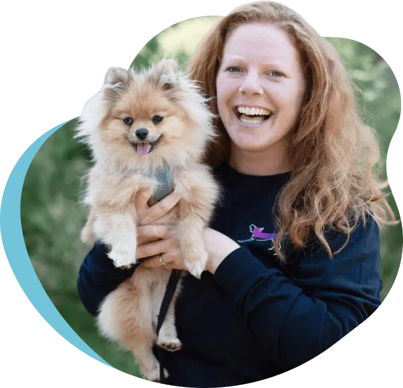 Aviva, ReadyDog co-founder and master trainer, holding her dog